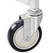 A close-up of the black and white castor wheel on a Winholt aluminum platter cart.