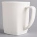 A Hall China bright white mug with a handle.