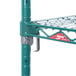 A green Metro Super Erecta wire shelf with metal hooks.