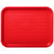 A red Carlisle plastic fast food tray with a diamond pattern.