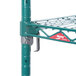 A Metroseal wire rack with green metal shelves and hooks.