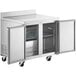 An Avantco stainless steel worktop refrigerator with two doors open.