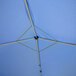 A blue Caravan Canopy tent with metal poles.