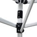 A close-up of the white metal frame of a Caravan Canopy V-Series 2.