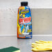 A box of 8 Drano Dual Force Foamer bottles on a counter next to yellow gloves.