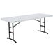 A white rectangular Lifetime plastic folding table with black legs.