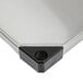 A close-up of a stainless steel Metro shelf.
