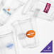 A clear Fabri-Kal plastic cup with a customizable logo on it.