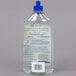 A clear plastic bottle of SC Johnson Pledge Multi-Surface Floor Care Finish with a blue cap and label.