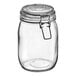 A clear glass storage jar with a hinge top and metal clasp closure.