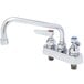 A T&S chrome deck-mounted workboard faucet with lever handles and a 6" swing spout.