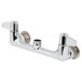 A chrome Equip by T&S wall mounted faucet base with lever handles.