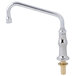 A silver and chrome T&S deck mounted faucet with a lever handle.