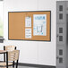 A classroom with a Quartet cork board on the wall.