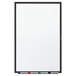 A Quartet melamine whiteboard with a black aluminum frame with markers on it.