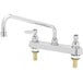 A chrome T&S deck mounted workboard faucet with lever handles.