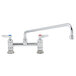 A T&S chrome deck mounted faucet with two lever handles.