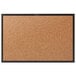 A Quartet cork board with black aluminum frame.
