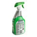 A green and white SC Johnson Fantastik Advanced Power Kitchen and Grease Cleaner spray bottle with a green handle.