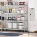 A Regency chrome heavy-duty dunnage shelving unit in a kitchen with containers on the shelves.