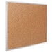 A Quartet cork board with a silver aluminum frame.