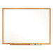 A Quartet melamine whiteboard with an oak finish.