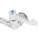 A chrome Equip by T&S wall mount faucet with wrist handles and a silver metal handle with a blue circle.