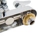 A T&S chrome wall mounted faucet with double-jointed swing spout and lever handles.
