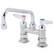 A T&amp;S chrome deck-mounted faucet with two lever handles.