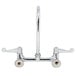 A chrome Equip by T&S wall mount faucet with wrist handles.