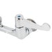 A chrome Equip by T&S wall mounted faucet with blue wrist handles.