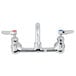 A T&S chrome wall mount faucet with lever handles.
