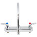 A chrome T&S deck-mounted workboard faucet with two lever handles.