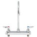 A T&S chrome deck-mounted faucet with two lever handles.
