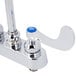 A chrome T&S deck-mounted workboard faucet with blue wrist handles.