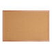 A close-up of a Quartet cork board with an oak finish wooden frame.