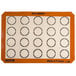 A white Sasa Demarle SILPAT® reusable baking mat with orange circles.