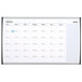 A white magnetic steel Quartet calendar with silver aluminum frame and black and blue lines.