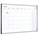 A whiteboard with a calendar on it.