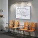 A room in a hospital cafeteria with chairs and a Quartet white board.