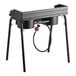 A black rectangular Backyard Pro double burner outdoor range with a hose attached.