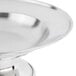 A close-up of a Town stainless steel serving dish with a stand.