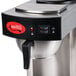 An Avantco On / Off switch on a stainless steel coffee maker with a red handle.