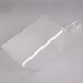 A clear plastic scoop on a white background.