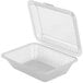 A close-up of a clear plastic GET Eco-Takeouts container with a lid.