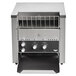 A Vollrath JT2 conveyor toaster on a counter in a school kitchen with a black and white control panel.