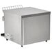 A silver rectangular Vollrath conveyor toaster on a counter.