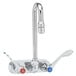 A T&S chrome wall mount faucet with two wrist lever handles.