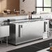 An Avantco stainless steel horizontal bottle cooler on a counter.