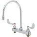 A silver deck-mounted T&S workboard faucet with wrist handles.